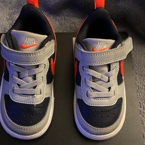 Nike Kids' Navy and Gray Sneakers with Orange Accents